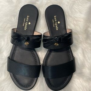 kate spade new york
Never worn leather slide sandal. 1/2" flat stacked heel.